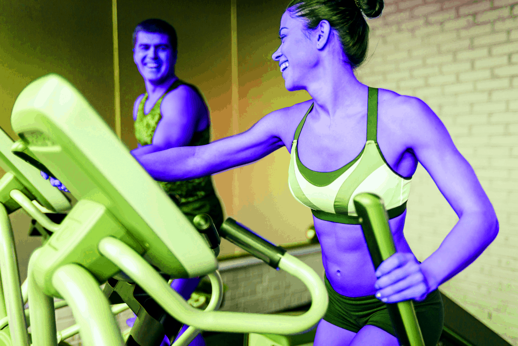 Young woman using her elliptical workout in her weight loss program - heydayDo image