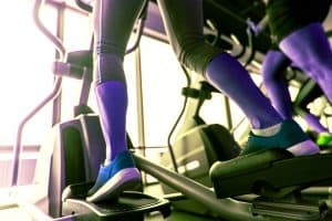 Woman with bad knees doing low impact cardio on elliptical machine - heydayDo image