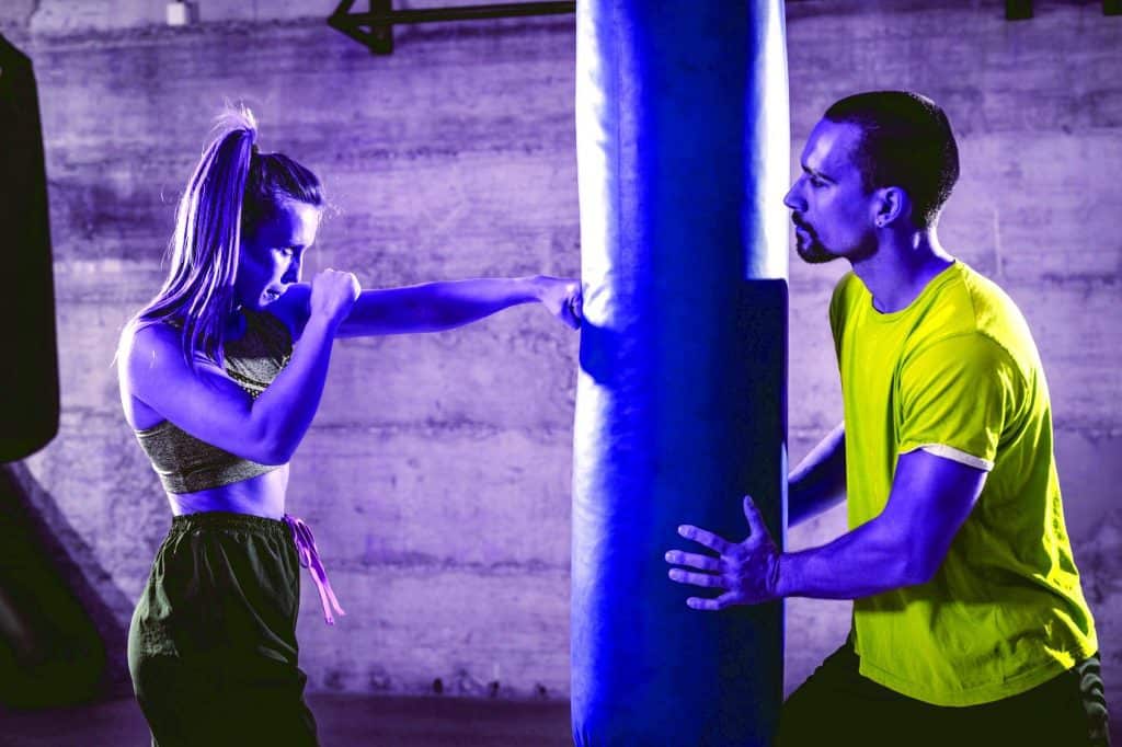 Young woman during her heavy bag workout - heydayDo image