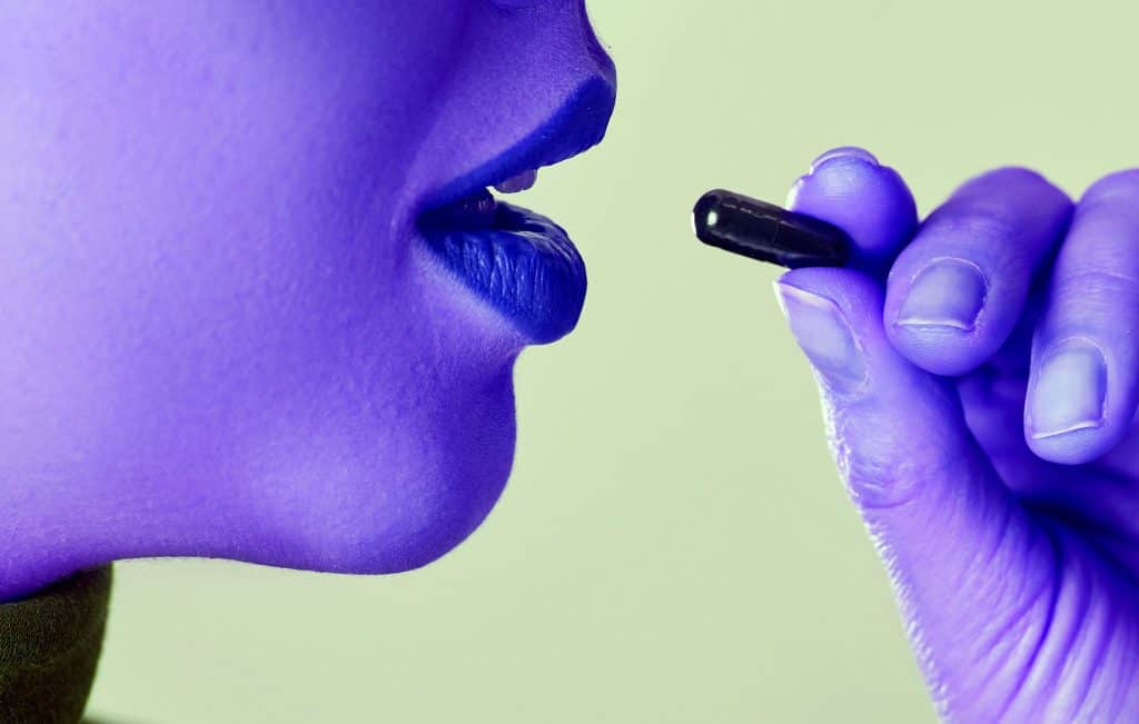 Woman taking a proprietary blend without knowing how much of each ingredient there is - heydayDo image