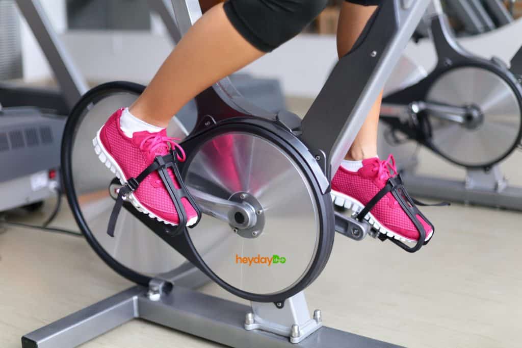 woman's legs pedaling a magnetic resistance bike