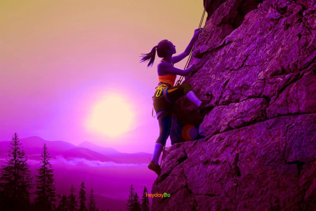Woman rock climbing at sunrise , from Best Vertical Climber featured image